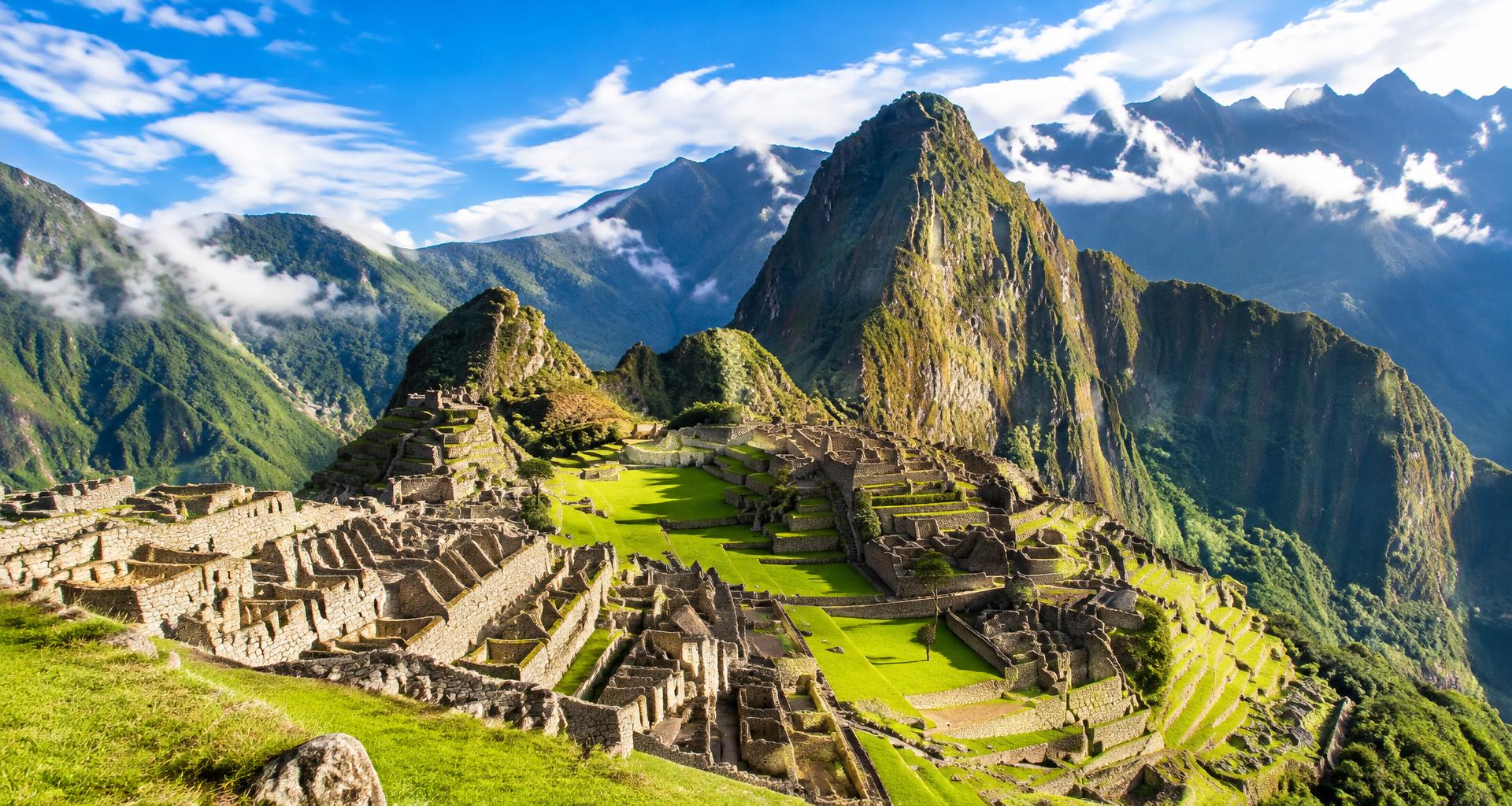 The green terraces of Machu Picchu beneath the dramatic peaks of the Peruvian Andes